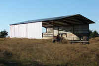 Metal frame barn with concrete floor