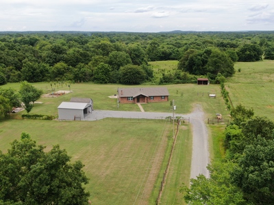 Brick home and 10 acres with a creek